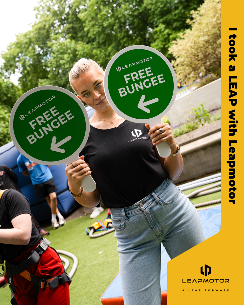 Woman holding signs for free bungee jumps